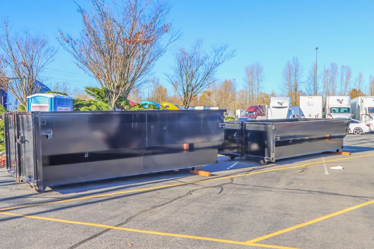 Professional dumpster rental service with roll-off container on residential driveway in Eagle Mountain